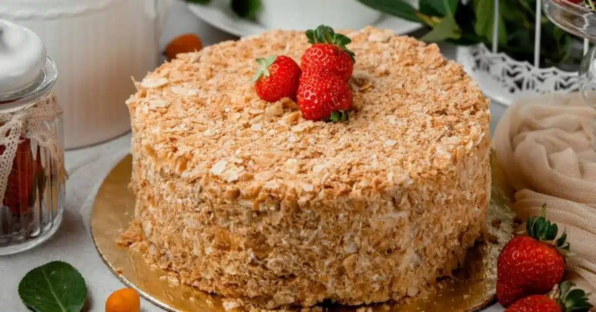 Close-up of a cake with strawberries on top.