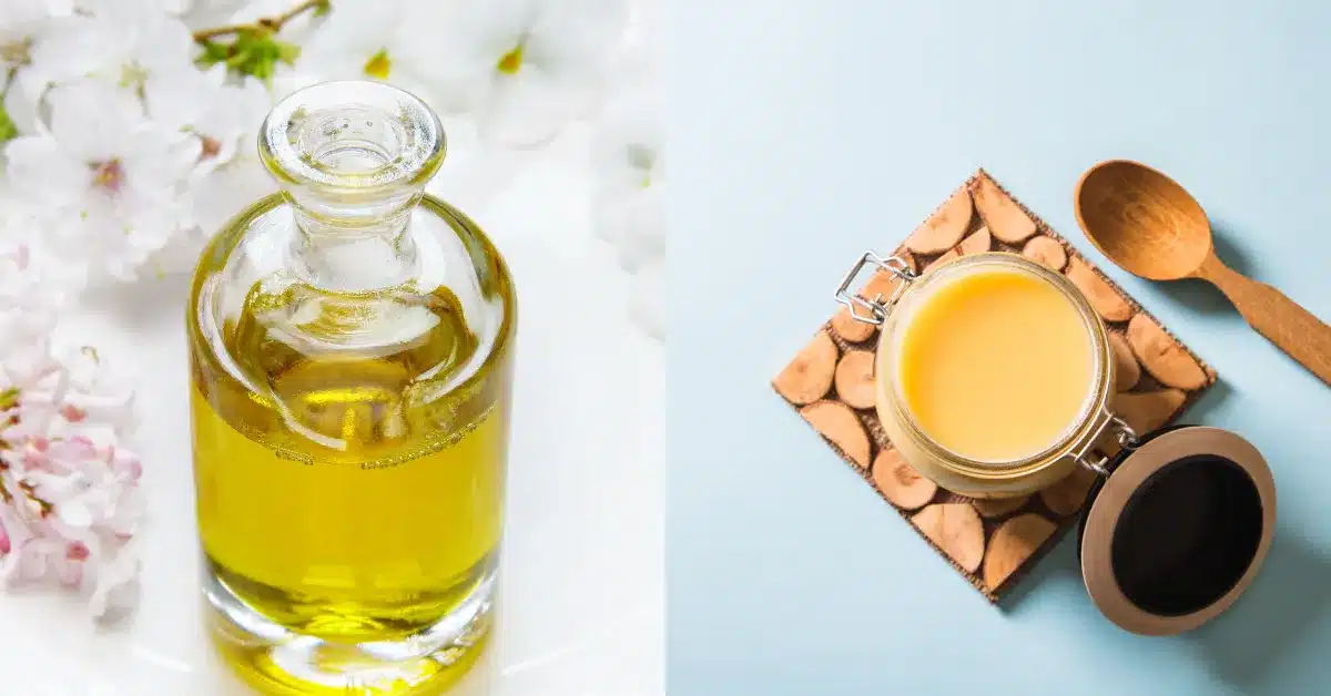 A glass bottle of olive oil and a ceramic jar of butter are sitting next to each other on a wooden tray. The olive oil bottle is tall and slender, with a dark green label. The butter jar is short and squat, with a yellow label. The wooden tray is light brown and has a rectangular shape.