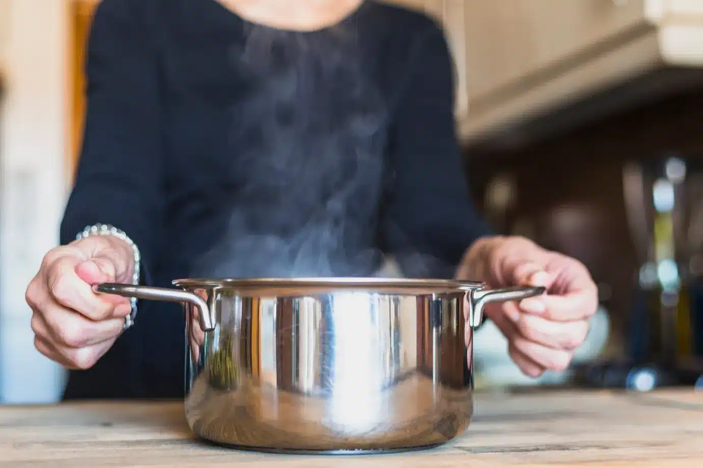 A woman cooking dish in kitchen using Crock Pot