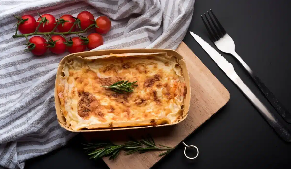 high angle view of tablecloth; fresh ingredient and delicious lasagna