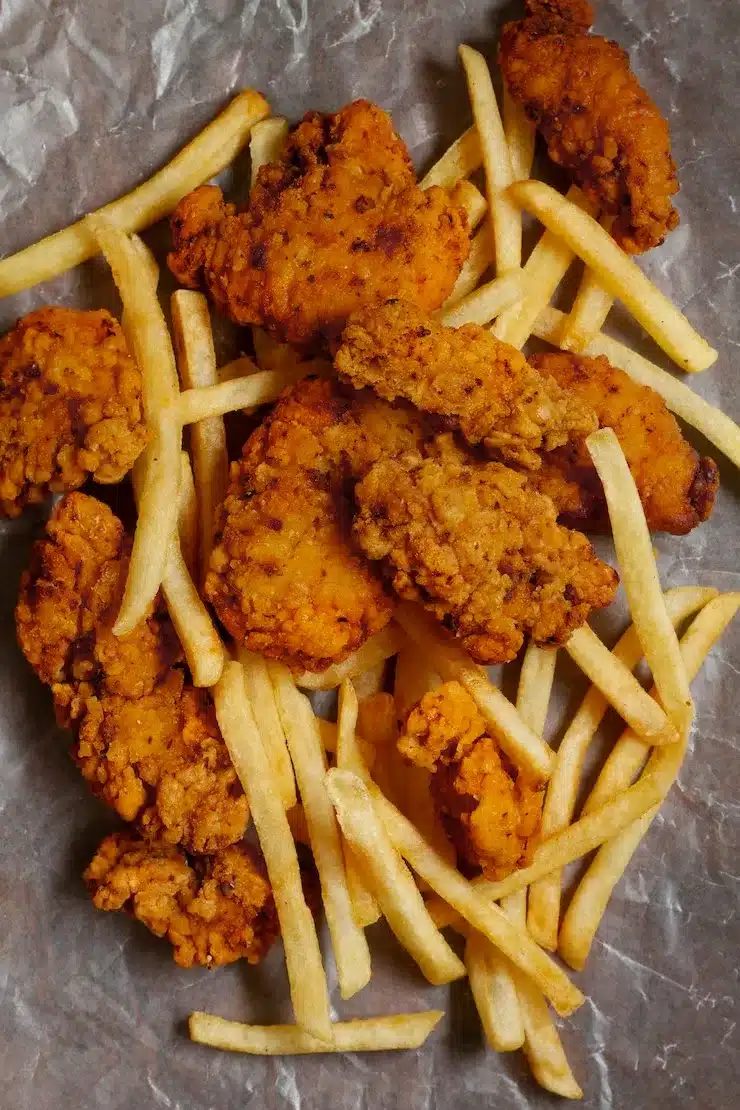 flat lay delicious boneless chicken and fries